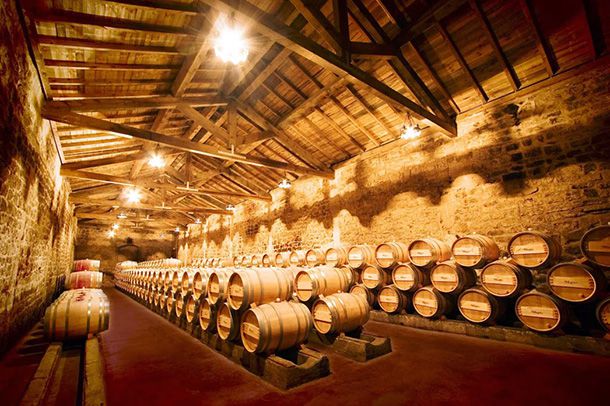 cellar full of wine barrels at Bodega Muga