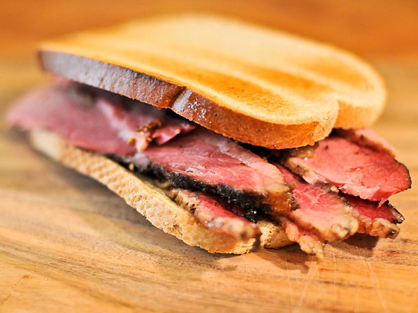 Slices of smoked brisket between two pieces of bread
