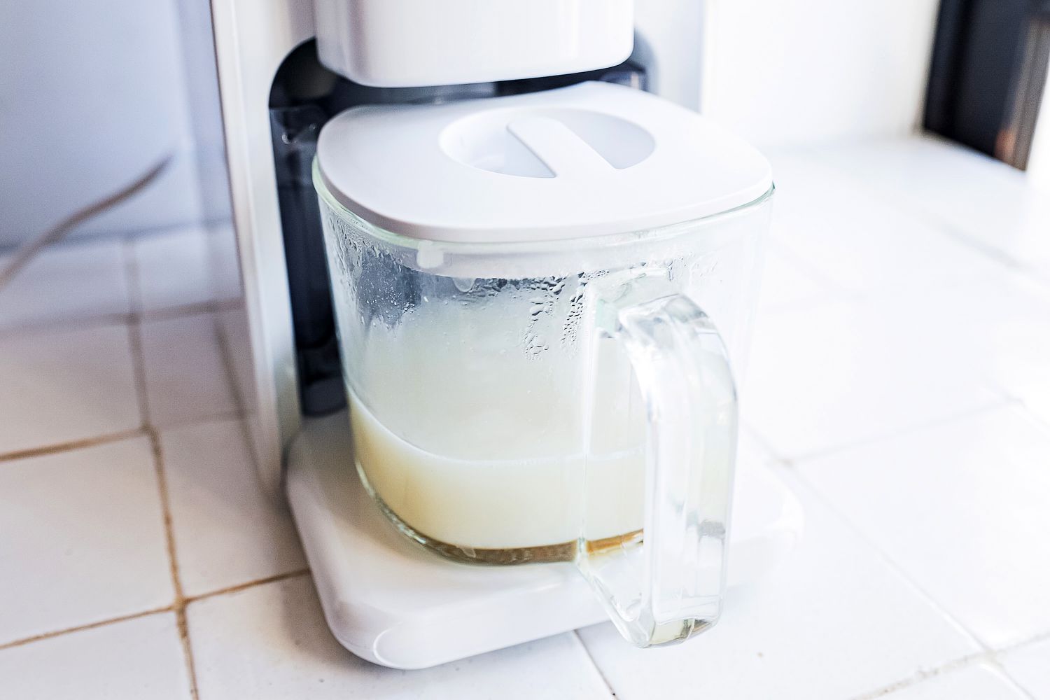 chefwave nut milk maker with nut milk in carafe. 
