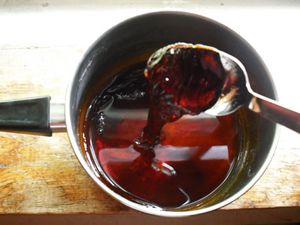 A small saucepan of dark, sticky Vietnamese caramel 