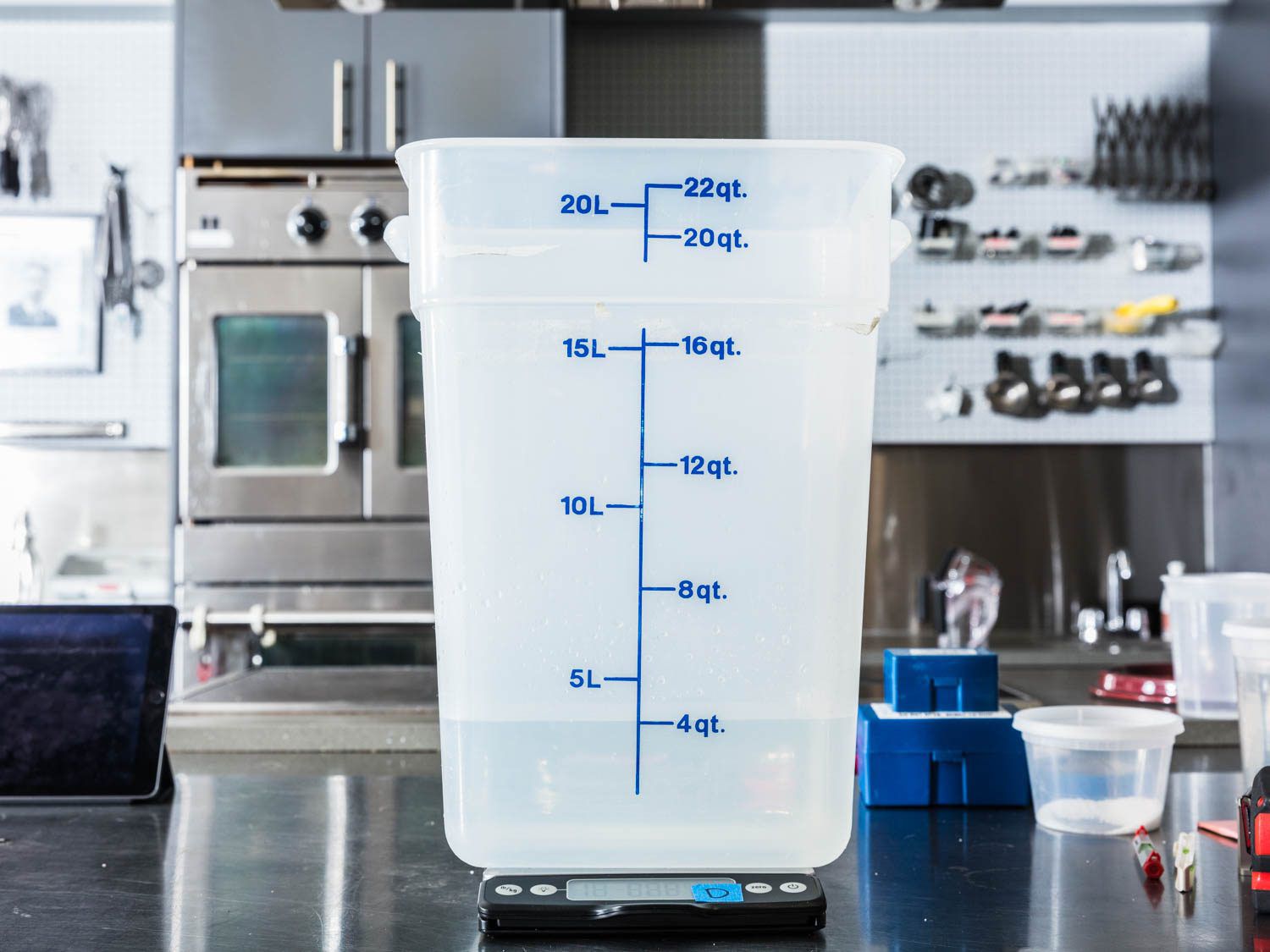 Weighing water on a digital kitchen scale.