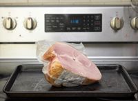 zingermans ham on a sheet tray on the stove