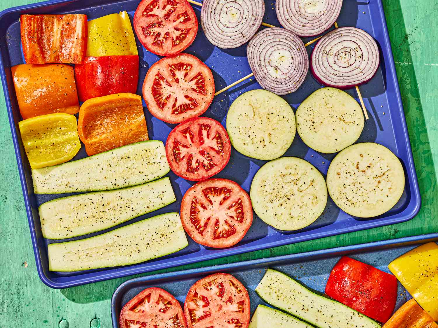 Assortment of vegetables arranged on a baking tray for grilling