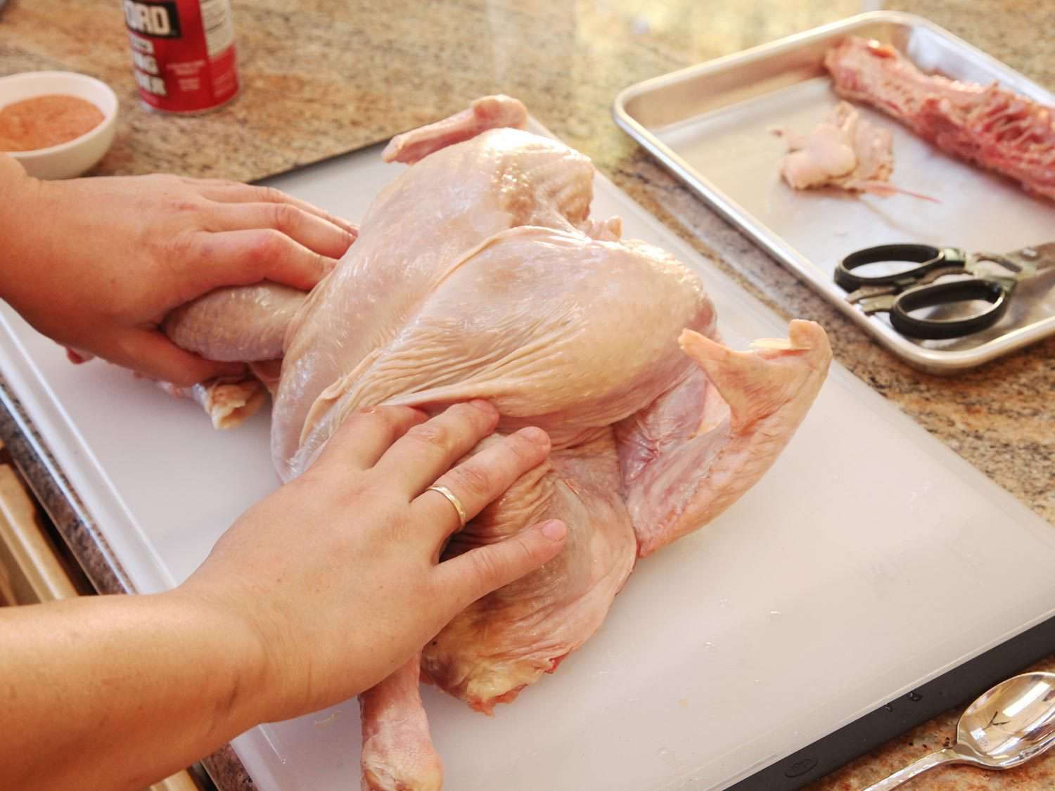 Spreading the turkey, preparing for spatchcocking.
