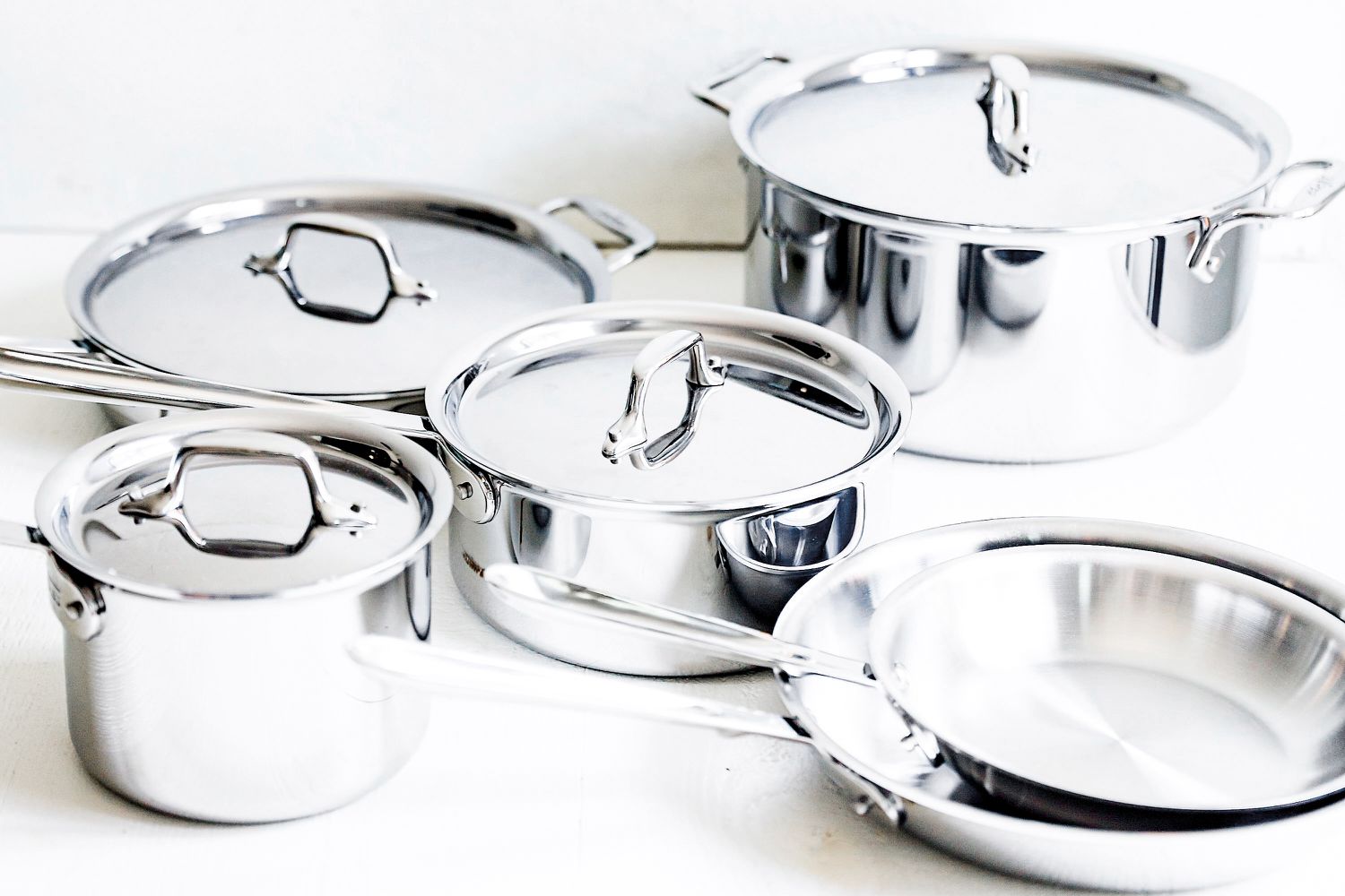 All-Clad D3 3-Ply Stainless Steel Cookware Set 10 Piece on a white surface