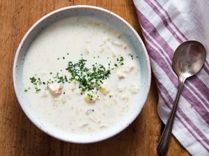 A bowl of Cullen skink, garnished with finely chopped chives.
