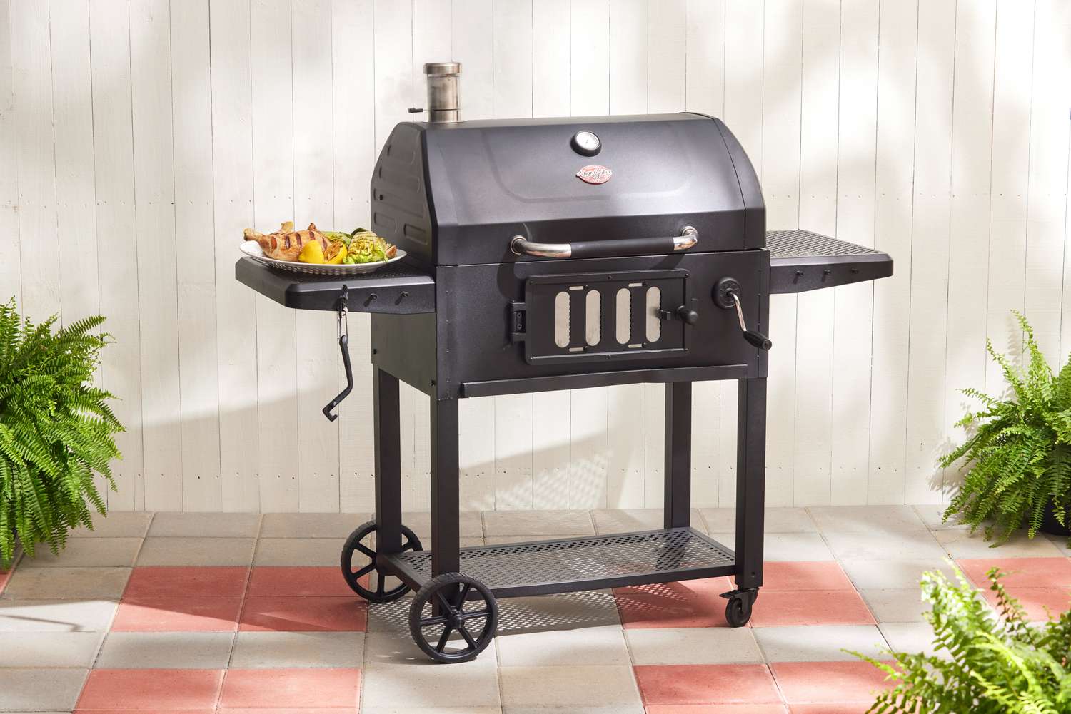 The Char-Griller Classic, with two collapsible work tables set up