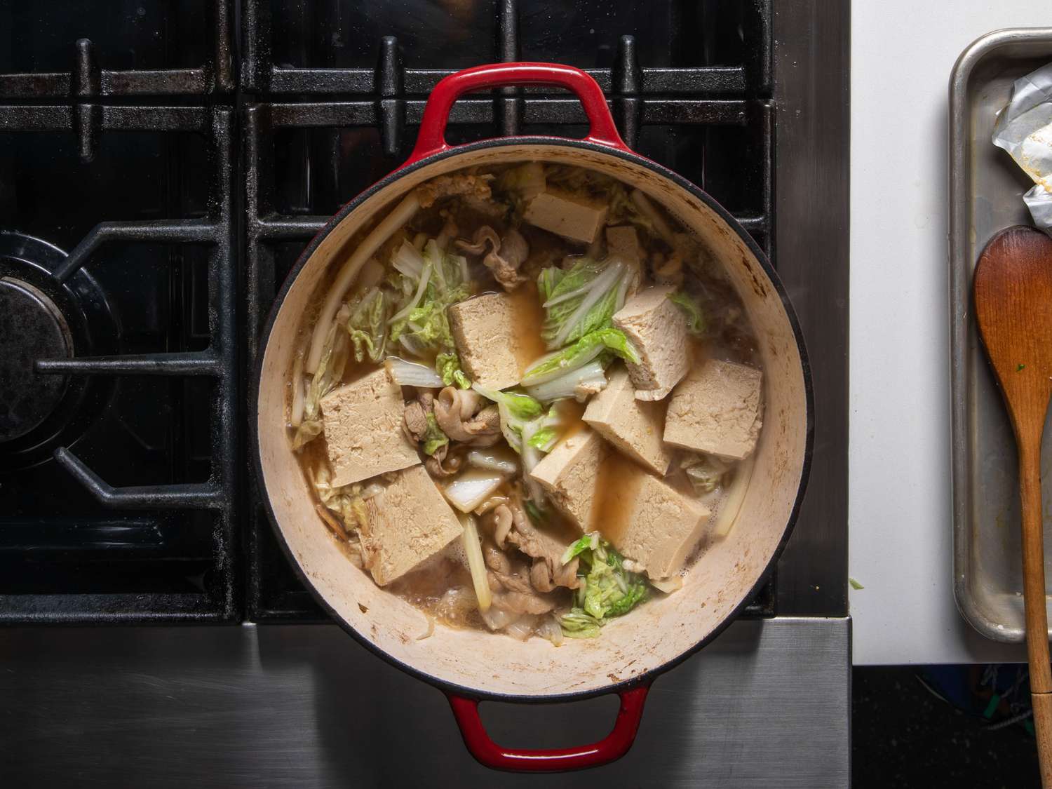 Frozen thawed tofu added to Dutch oven