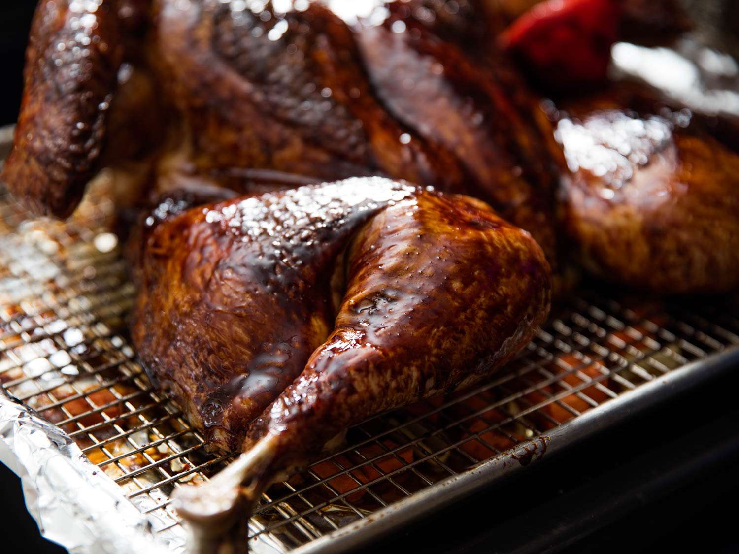 Closeup of the leg quarter of Chinese red sauce-glazed turkey.