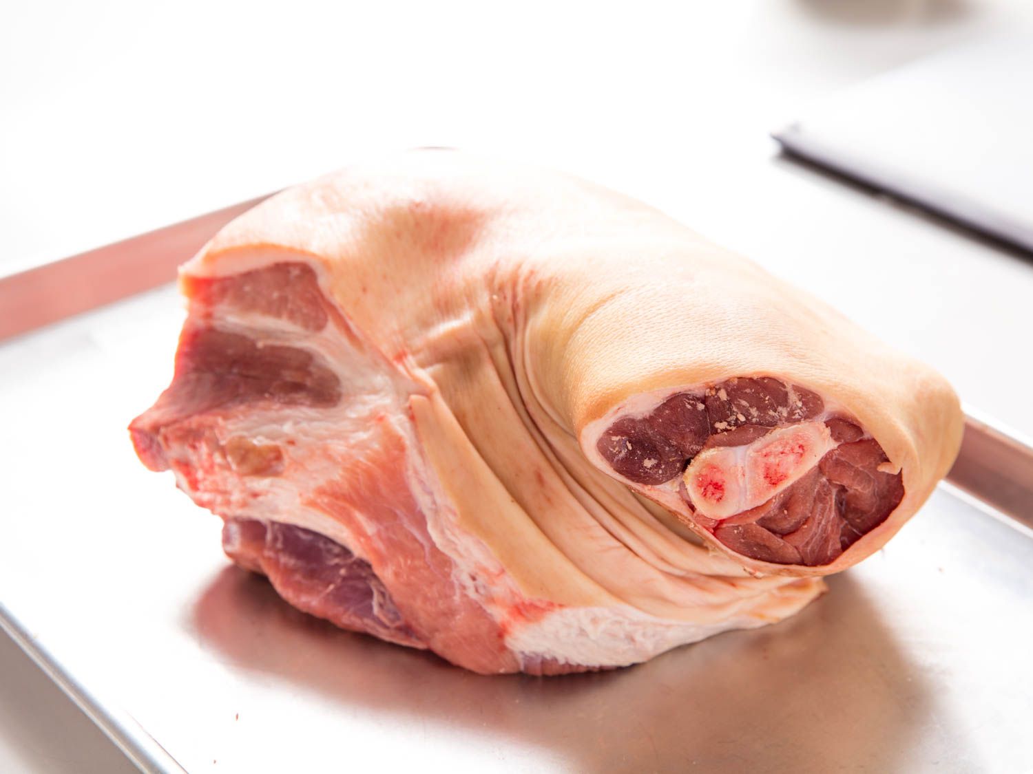 Closeup of a raw bone-in pork shoulder