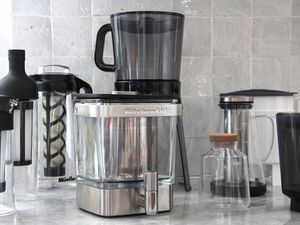 Numerous cold brew maker son a kitchen countertop.
