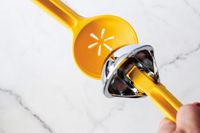 A person holding the Chef'n citrus juicer open.