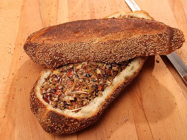 filled muffaletta loaf with top crust askew