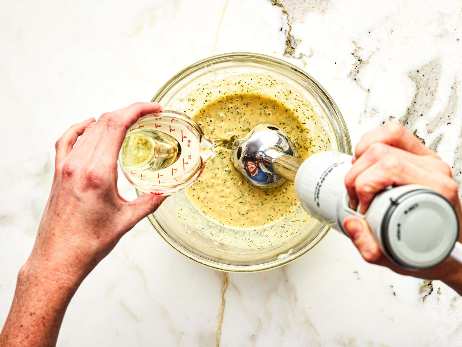 Sauce for gravlax being made in a bowl with immersion blender