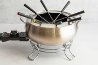 The Cuisinart fondue pot on grey countertop.