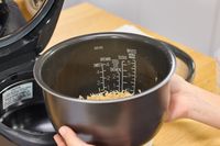 The measurements printed on the inside of the Zojirushi NW-QAC10 Induction Heating Rice Cooker & Warmer