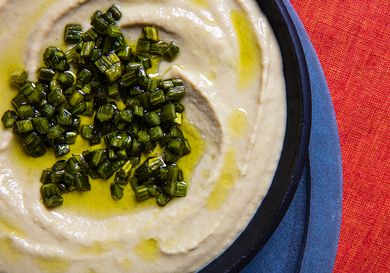 Overhead, close up view of garlic scape hummus