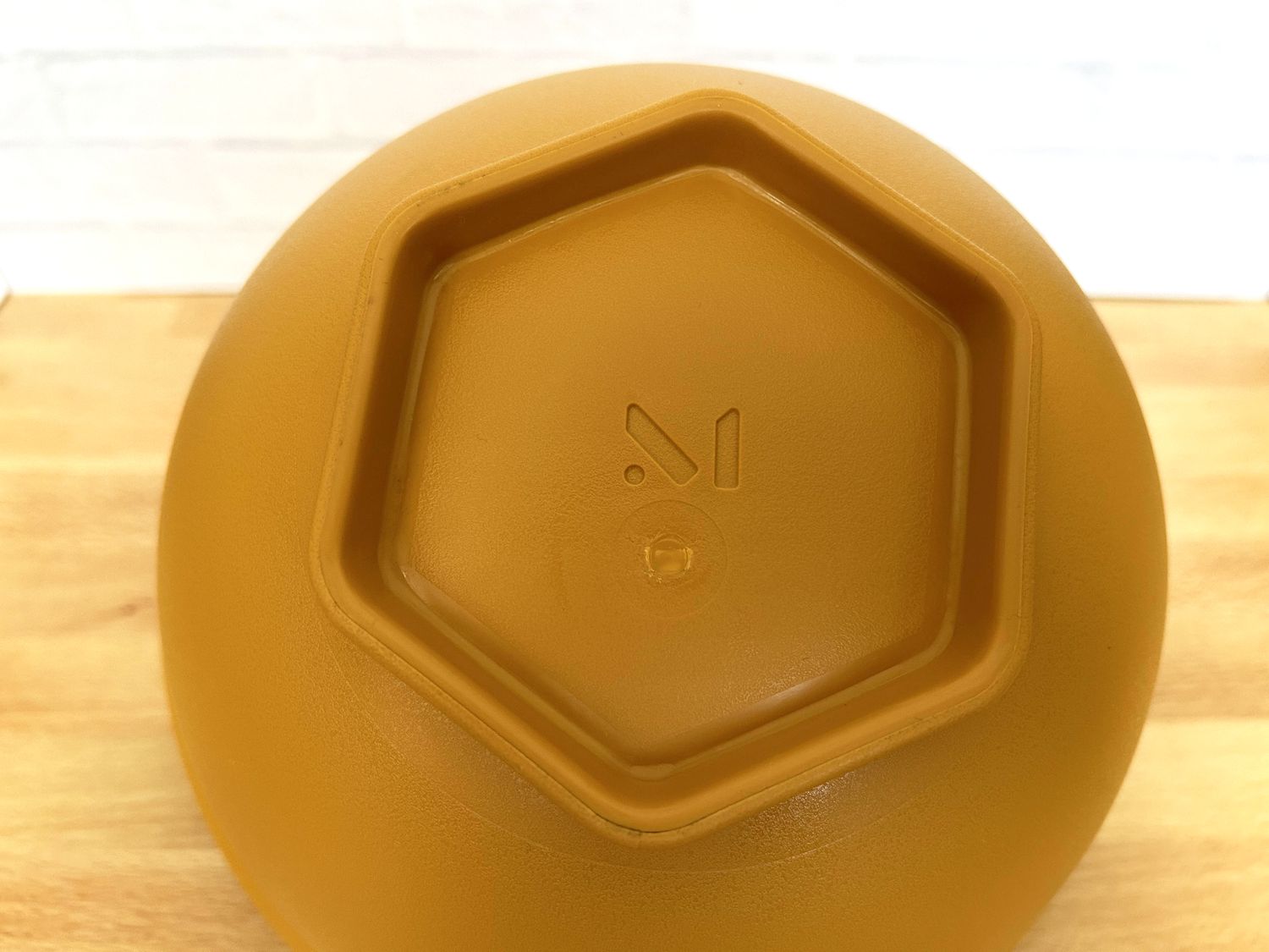 The bottom of a mixing bowl on a countertop