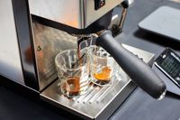 Close up of the Rancilio Silvia Espresso Machine brewing two espressos into glasses