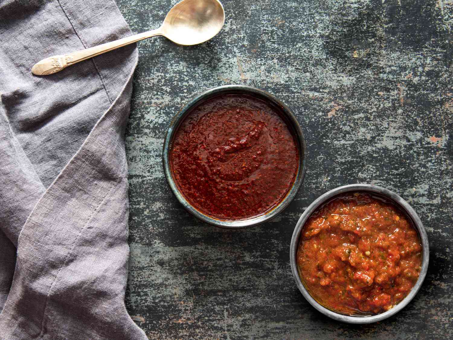 Two harissas; one made from dried chilies and the other made from fresh chilies.