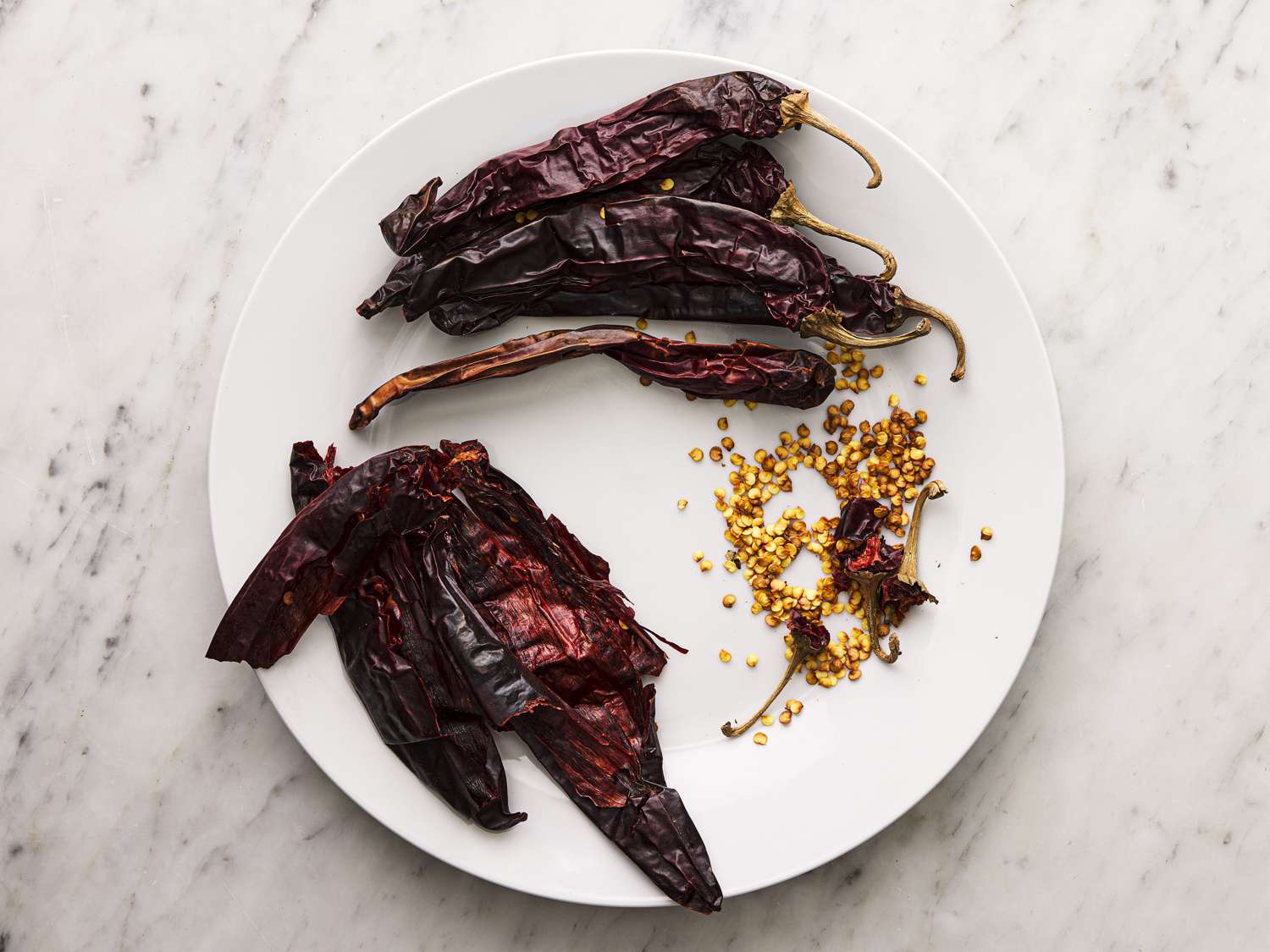 Seeds separated from peppers on a plate.