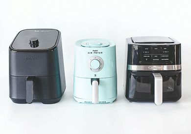 Three air fryers of different brands are displayed