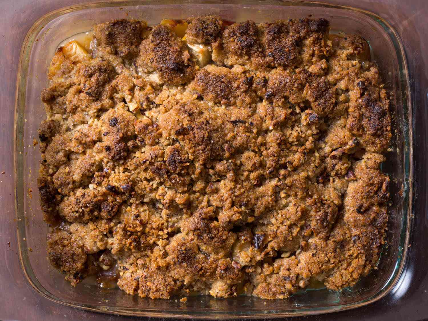 Overhead shot of a baked apple crisp, with a well-browned crumb topping