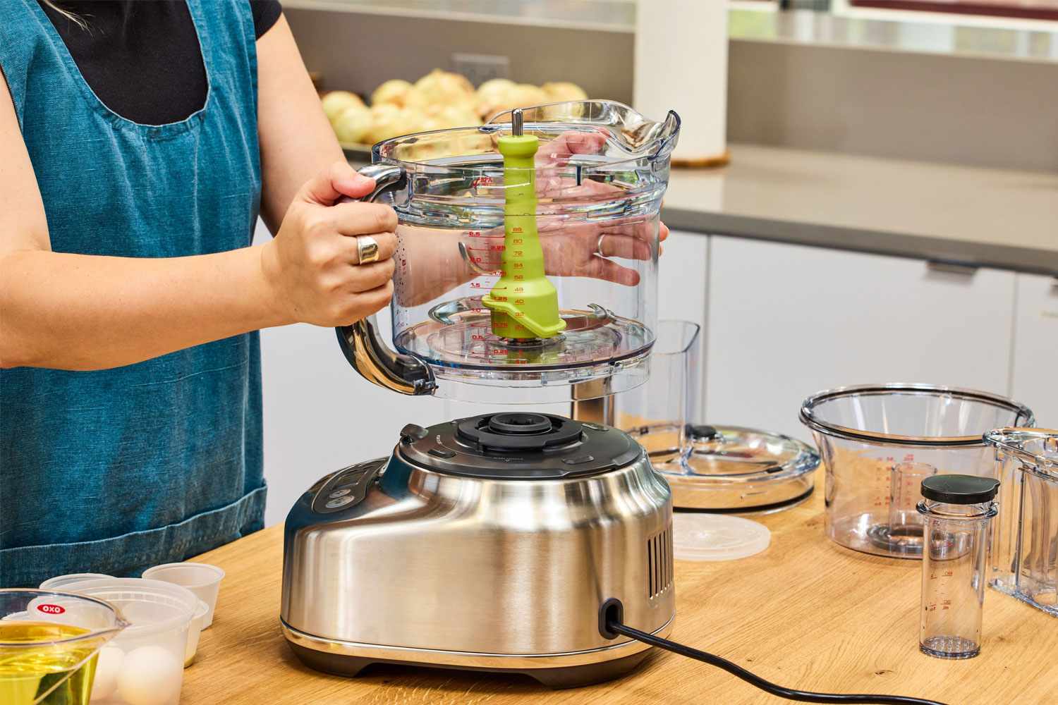 A person assembles the Breville BFP838BSS1BNA1 16-Cup Paradice Food Processor