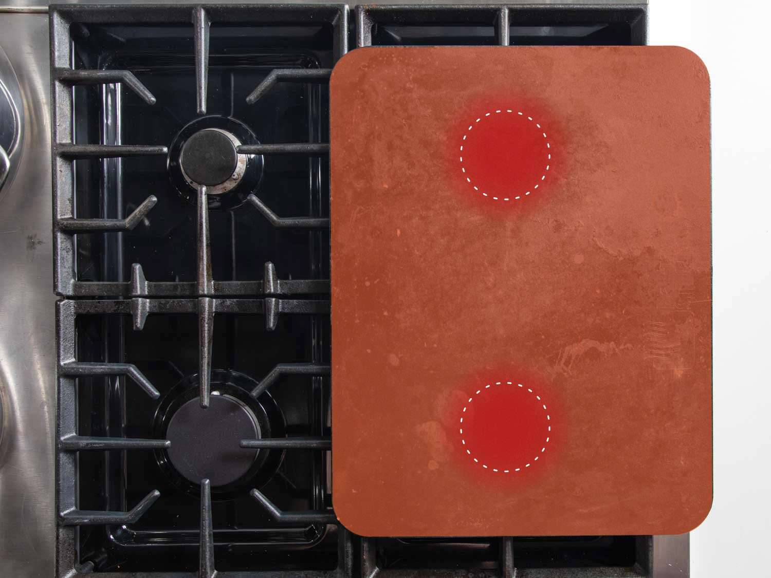 Overhead view with illustration of Baking Steel heated over two burners at medium heat for simmering multiple pans of food.