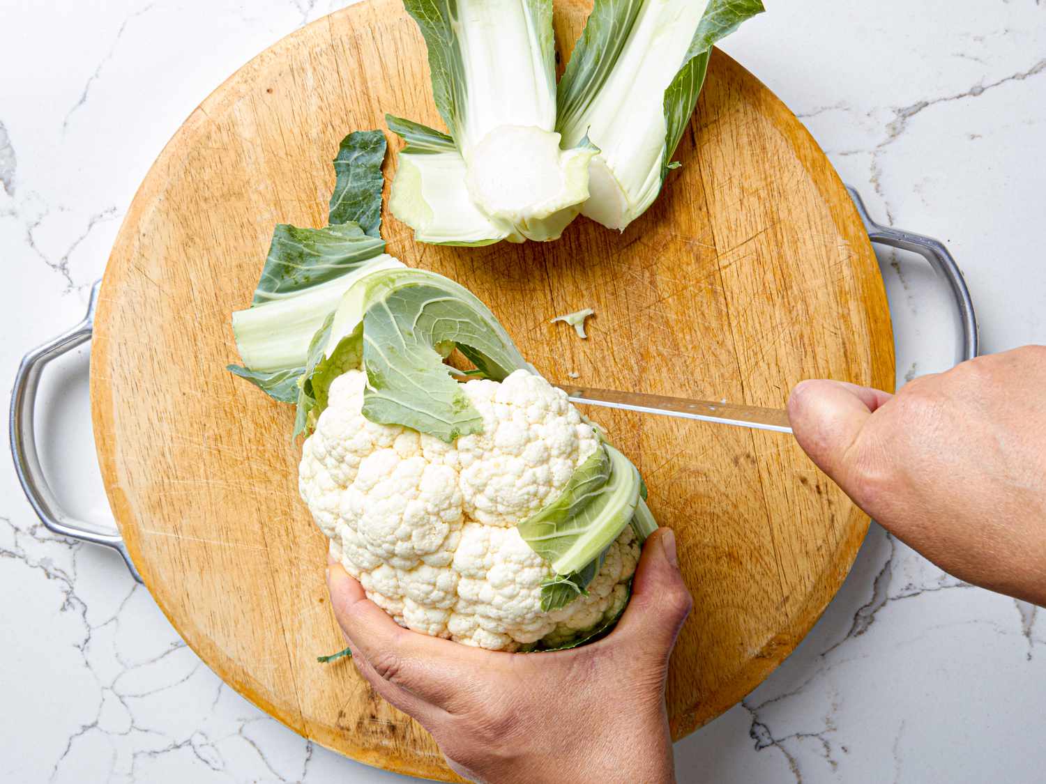 Overhead view of trimming cauliflower