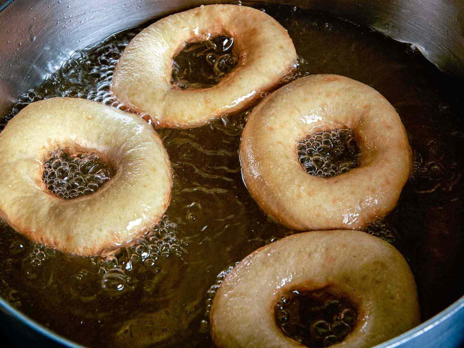 doughnuts frying in oil