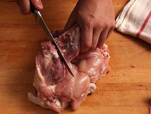 Cutting through connective tissue to separate thigh ball joint