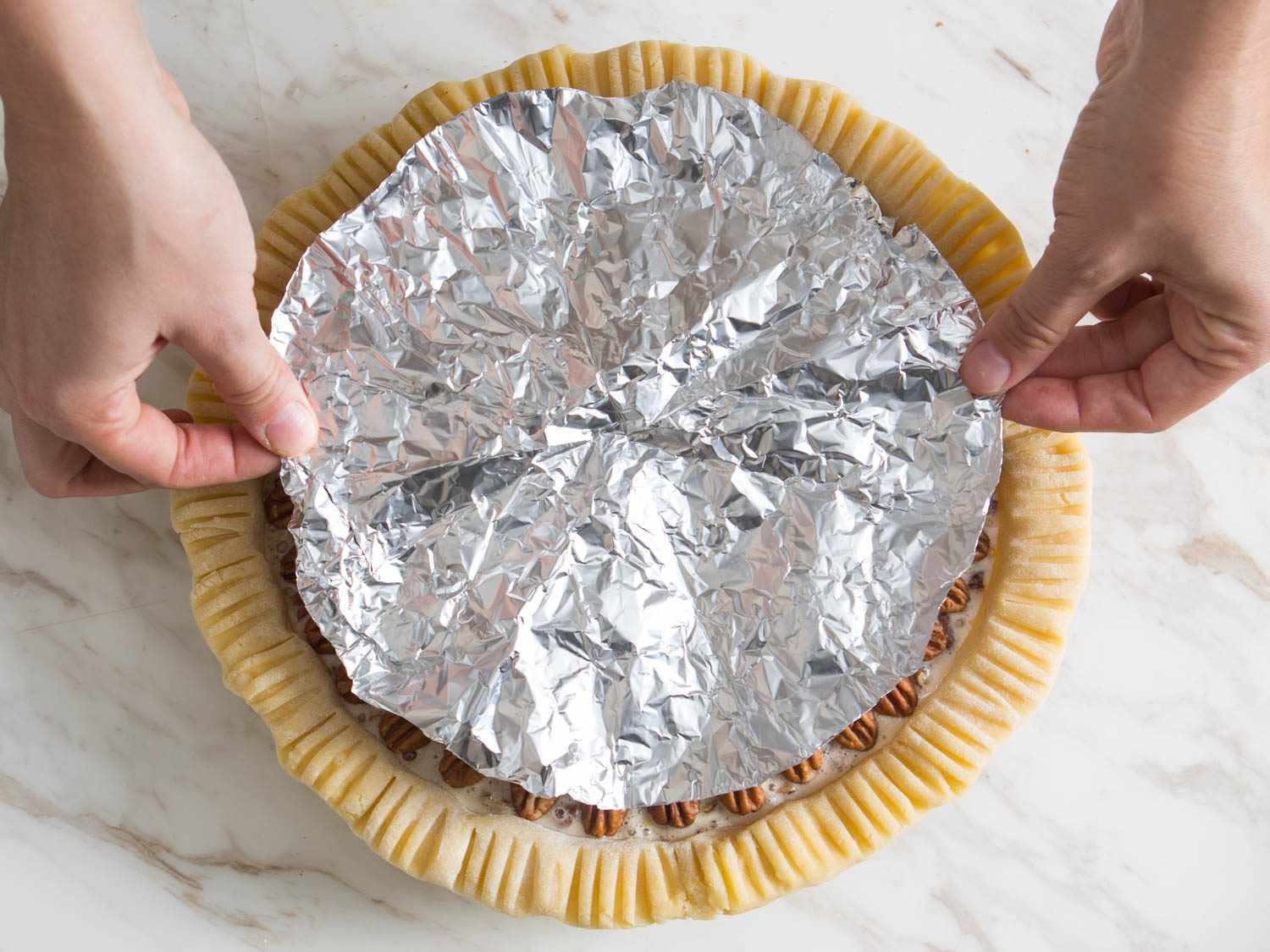 The foil shield is unfolded and fits perfectly over pie filling.