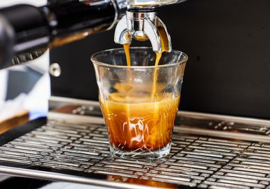 Closeup of the Diletta Mio Espresso Machine brewing an espresso into a glass