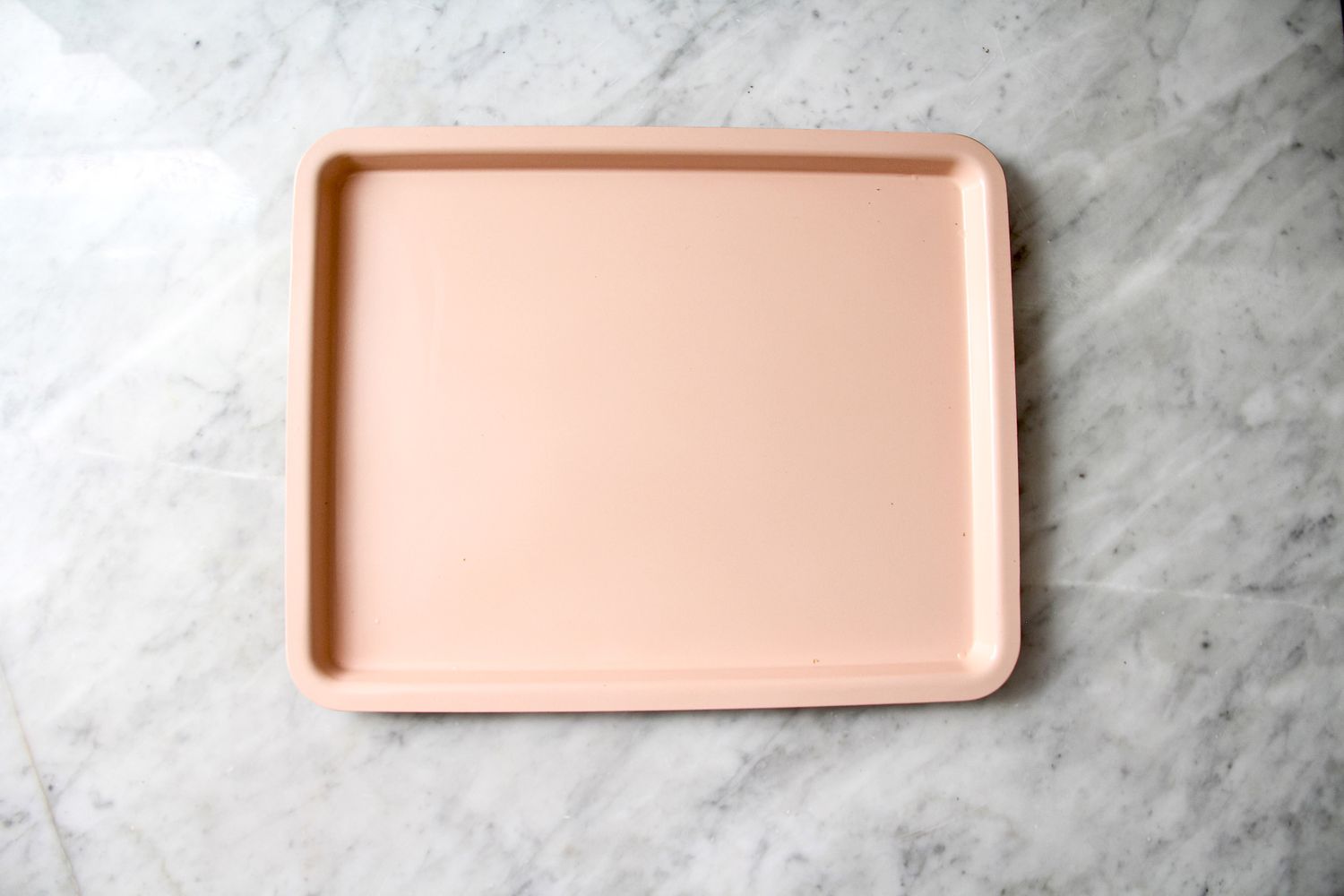 A rectangular baking tray on a marble surface