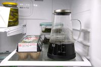 The Ovalware cold brew maker on a fridge shelf.