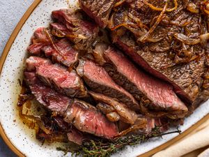 A close up shot of a sliced, pan-seared, butter-basted steak.