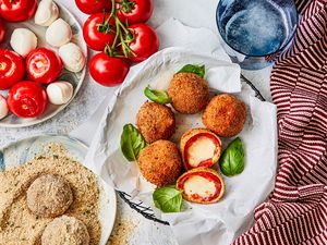 Fried caprese balls laid out on a plate.