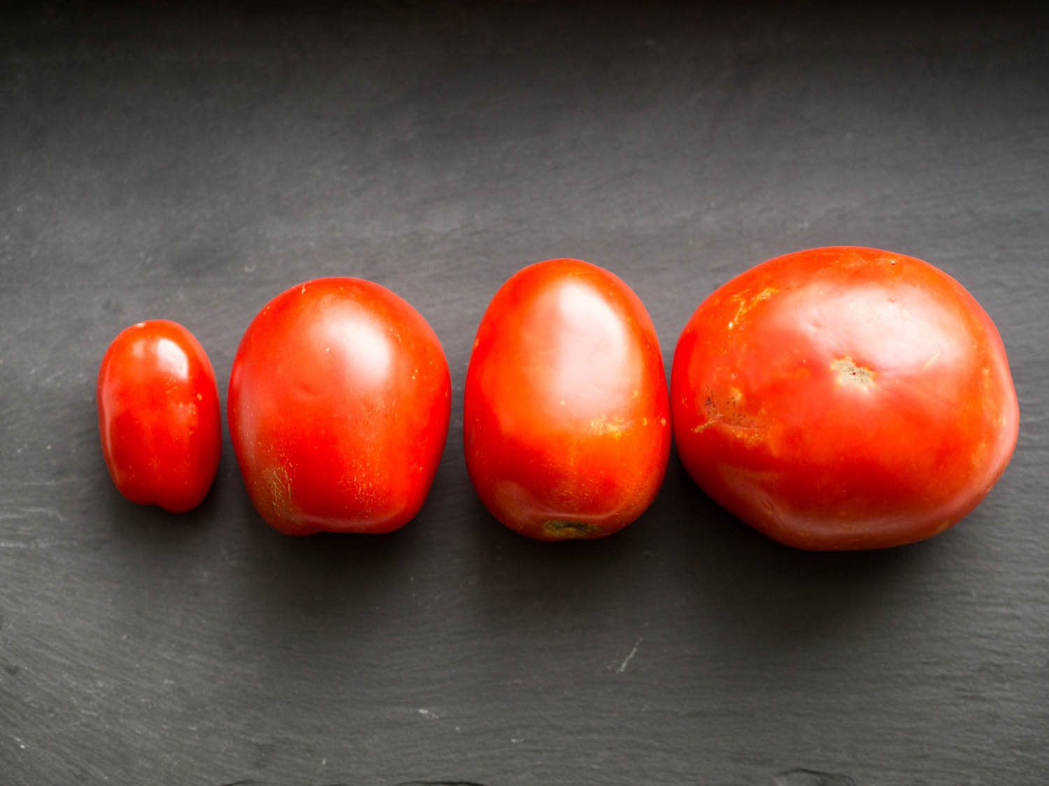 Different varieties of fresh whole tomatoes