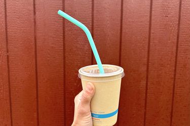 A to-go drink cup with a silicone reusable straw in it