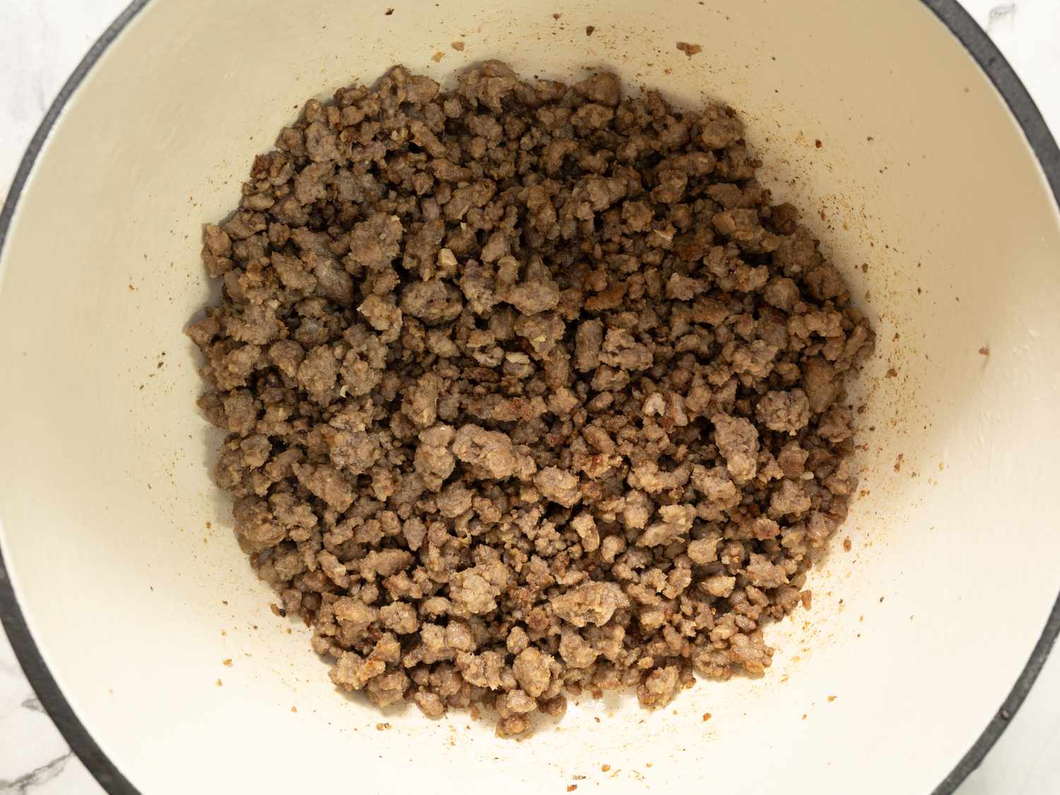 Cooked ground meat in a pot, step in preparing a recipe