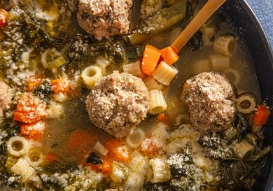 Italian wedding soup in a bowl with vegetables and meatballs