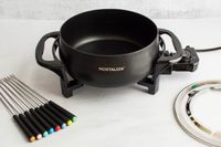 The Nostalgia fondue pot with its forks and fork ring.