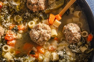 Italian wedding soup in a bowl with vegetables and meatballs