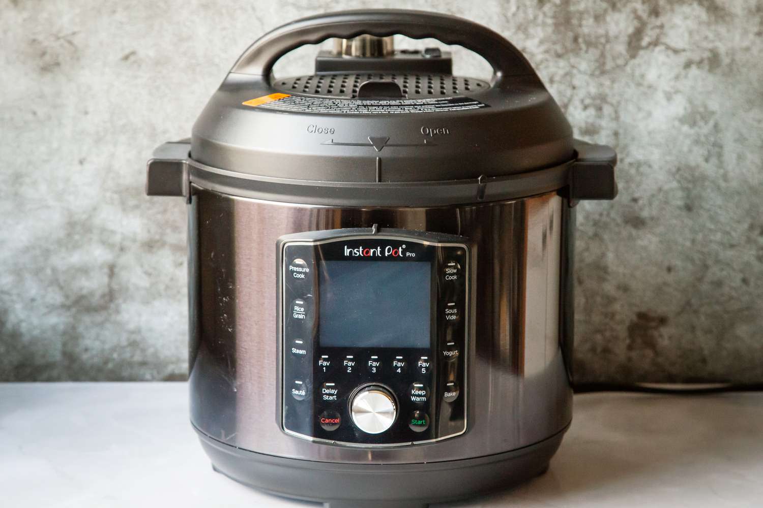 The Instant Pot Pro on a gray countertop. 
