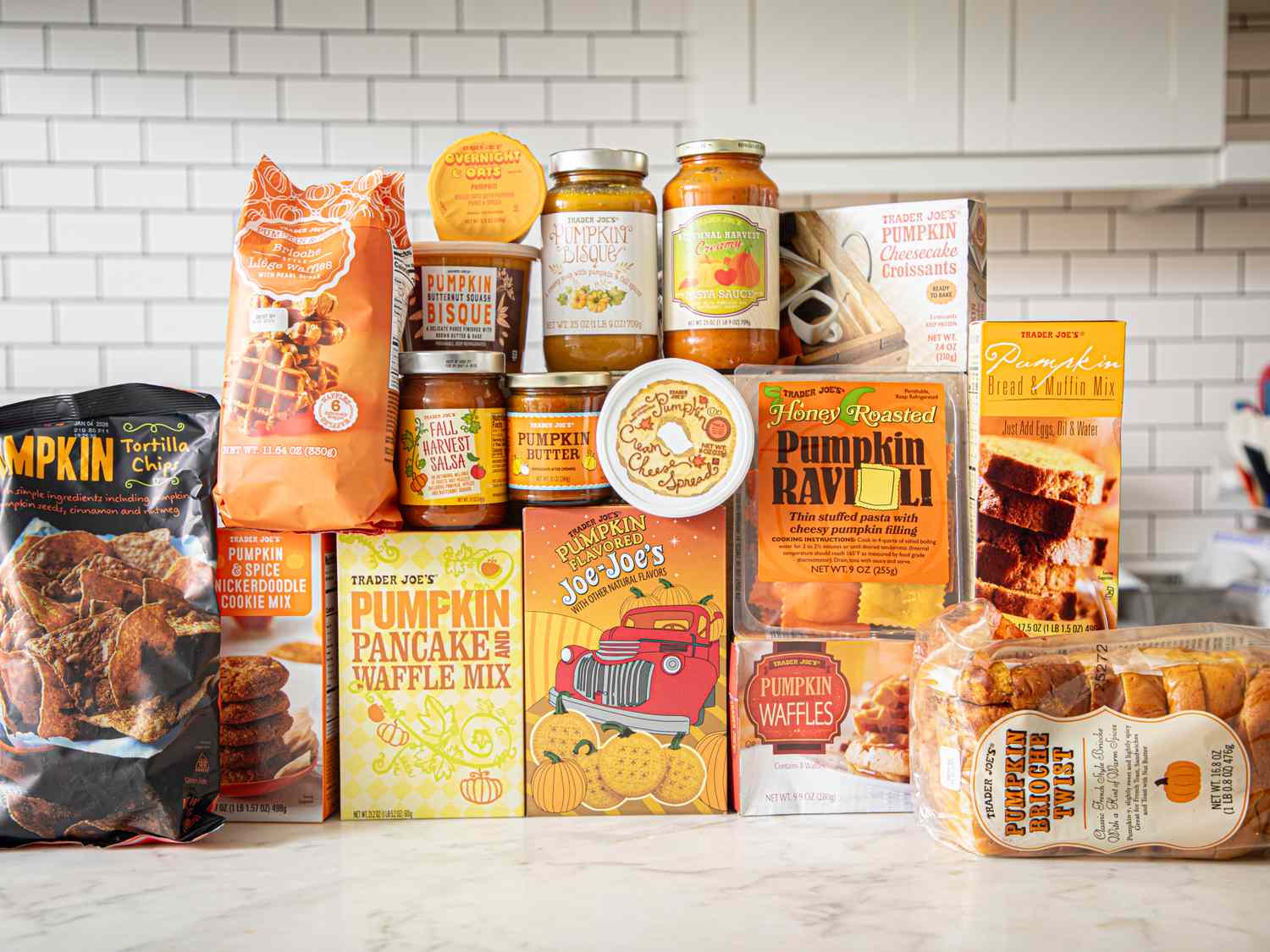 An assortment of pumpkinflavored products from Trader Joes arranged on a countertop