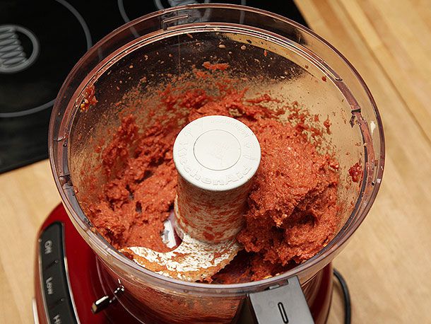 Processing the meat and ice in a food processor.