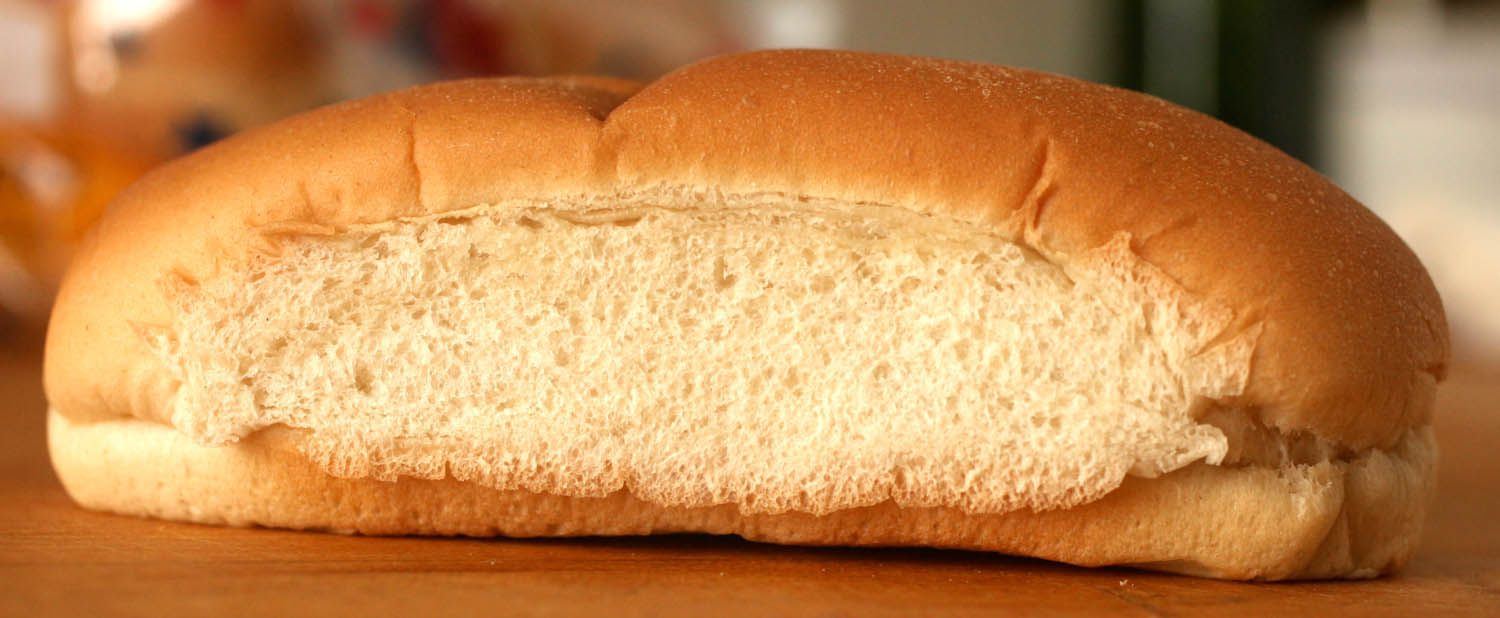 Side view of top-split hot dog bun
