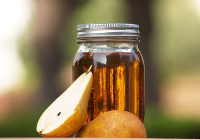 Mason jar of DIY pear liqueur