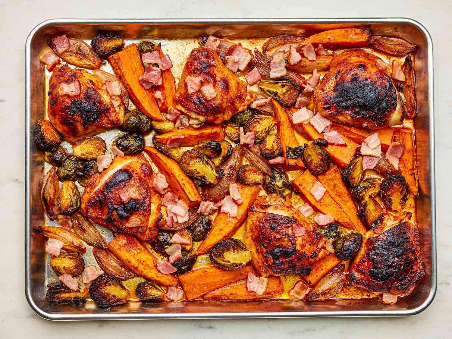 Sheet pan of roasted chicken and vegetables 